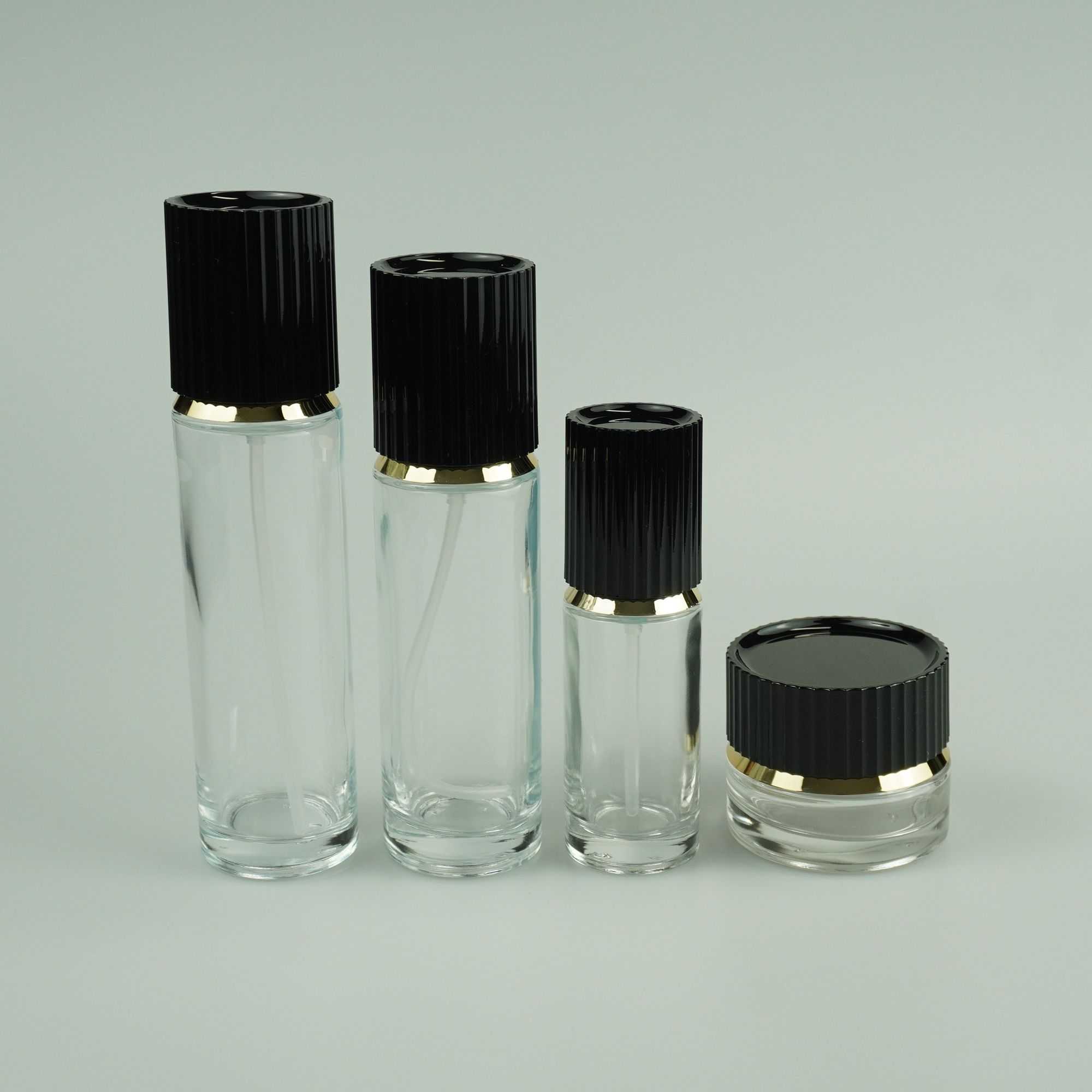 30‑100ML Round Clear Glass Bottle & Jar Set With Black Ribbed Gold‑Trim Cap
